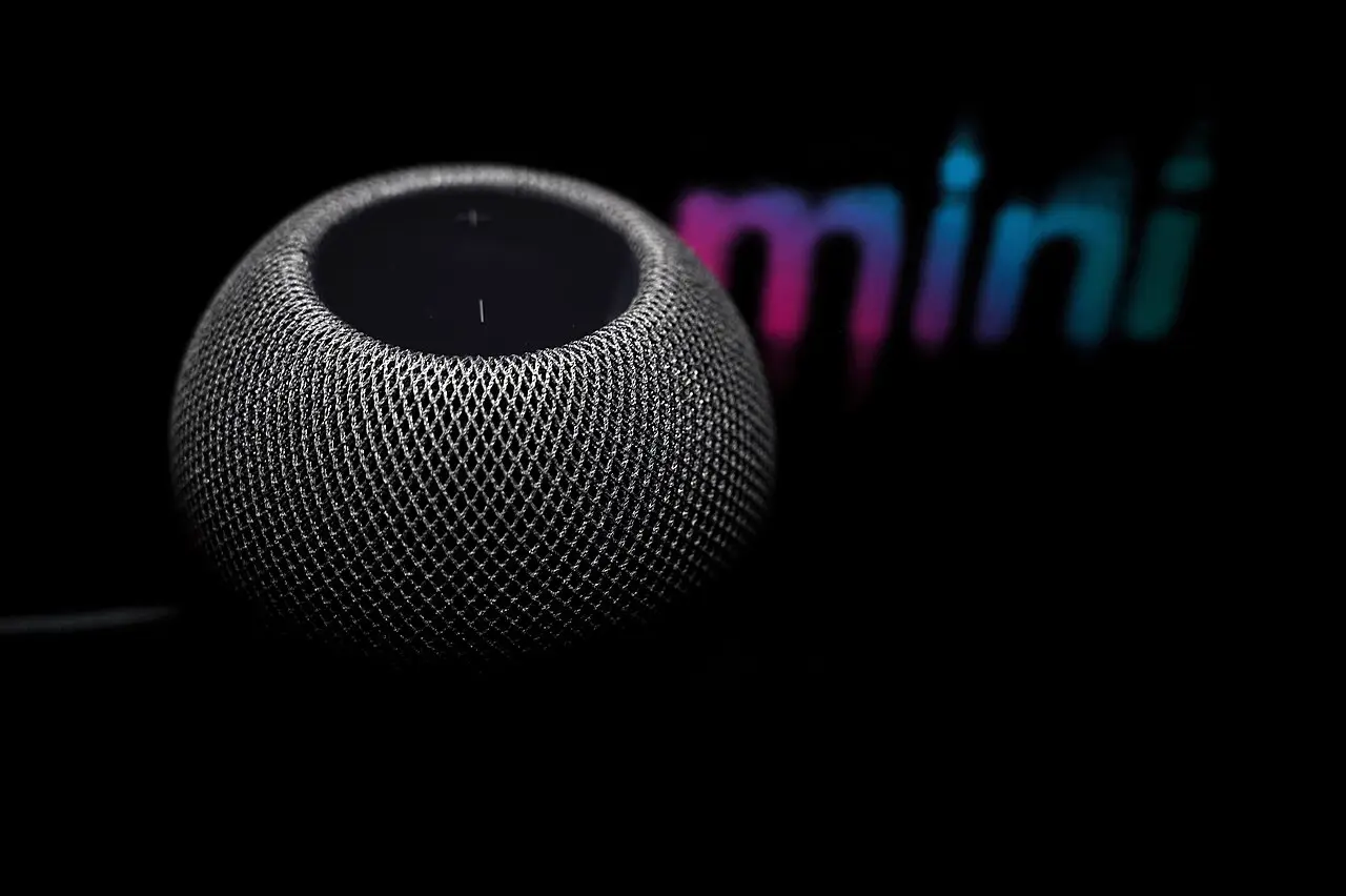 HomePod mini against a dark background