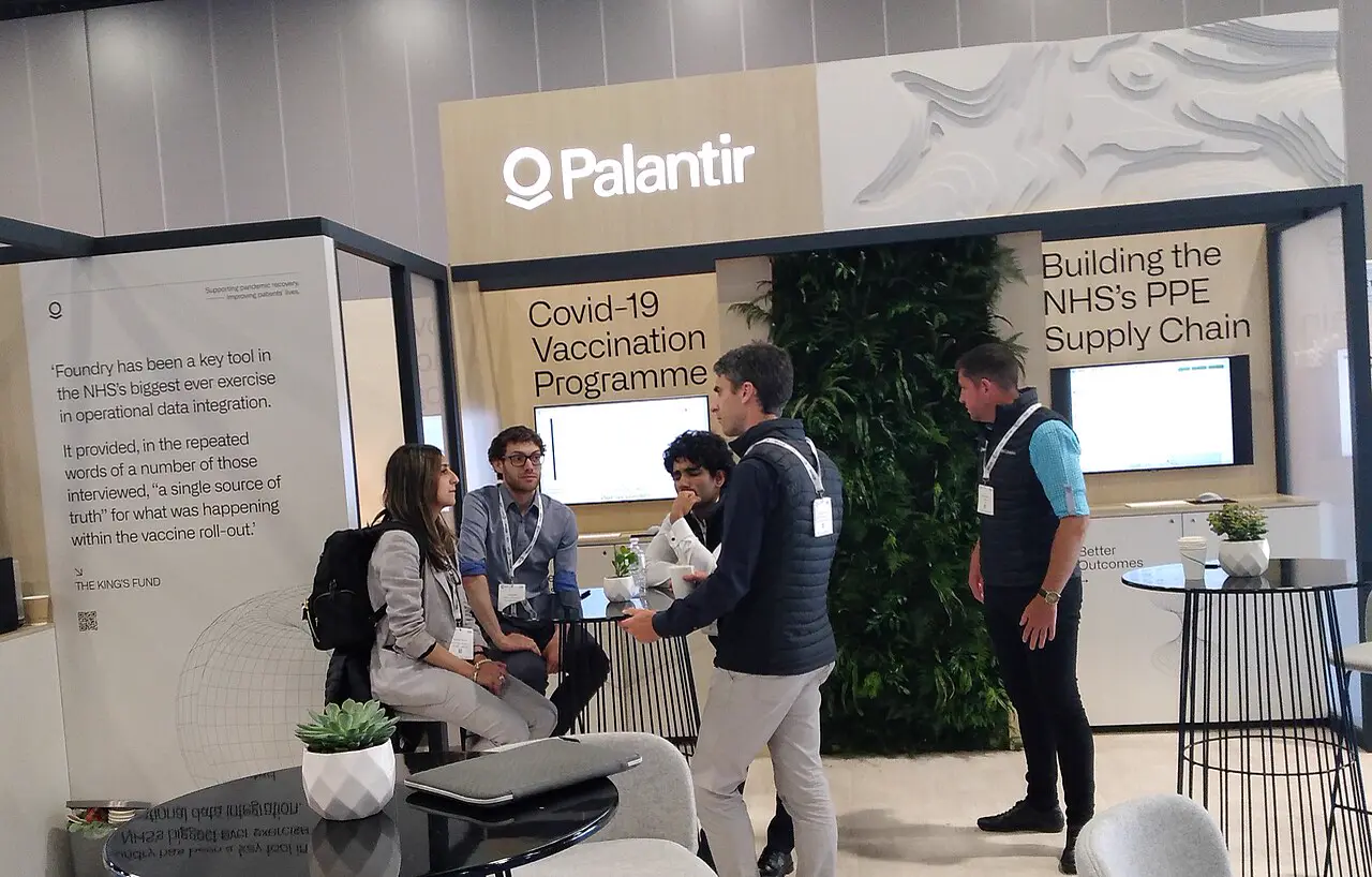 Palantir exhibition stand with visitors