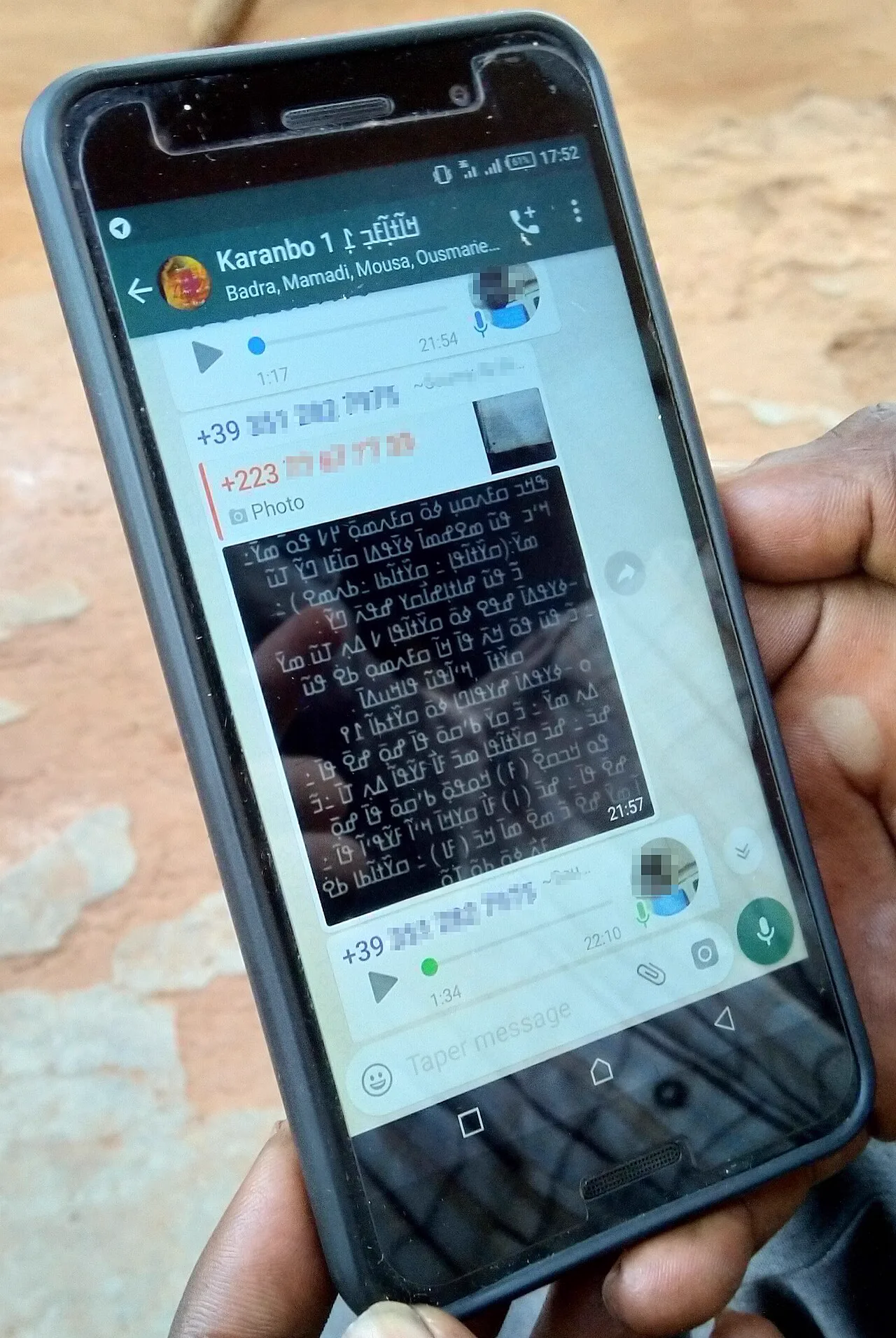 WhatsApp group chat on a smartphone